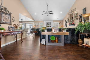 Living area featuring wood finished floors, ceiling fan, recessed lighting, and lofted ceiling