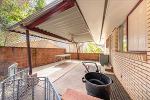 Fenced backyard featuring a patio