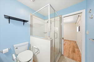 Bathroom featuring a stall shower and tile patterned flooring