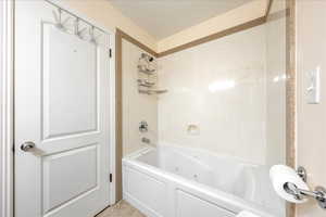 Full bathroom featuring a combined bath / shower with jetted tub