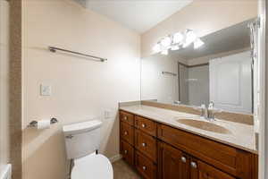 Full bathroom featuring toilet and vanity