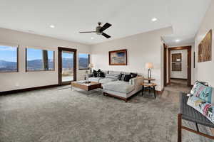 Living room with ceiling fan, carpet floors, a mountain view, and recessed lighting