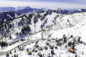 Snowy aerial view with a mountain view