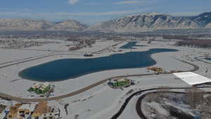 Snowy aerial view featuring a mountain view
