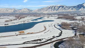 Snowy aerial view featuring a mountain view