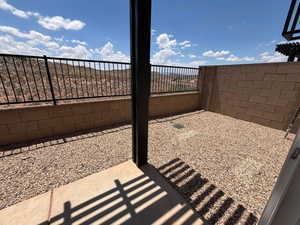 View of fenced backyard