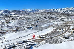 Snowy aerial view featuring a mountain view