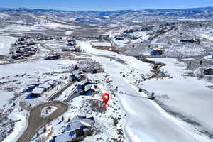 Snowy aerial view with a mountain view