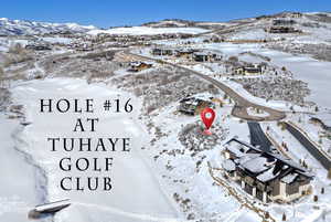 Snowy aerial view featuring a mountain view