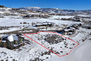 Aerial overview of property's location with mountains and property parcel outlined