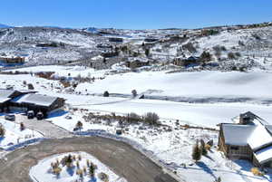 Snowy aerial view featuring a mountain view