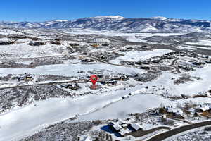 Snowy aerial view with a mountain view