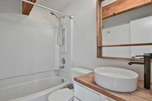 Bathroom featuring shower / bathtub combination and vanity