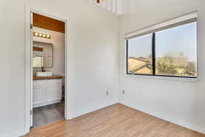 Unfurnished bedroom featuring light wood-style floors