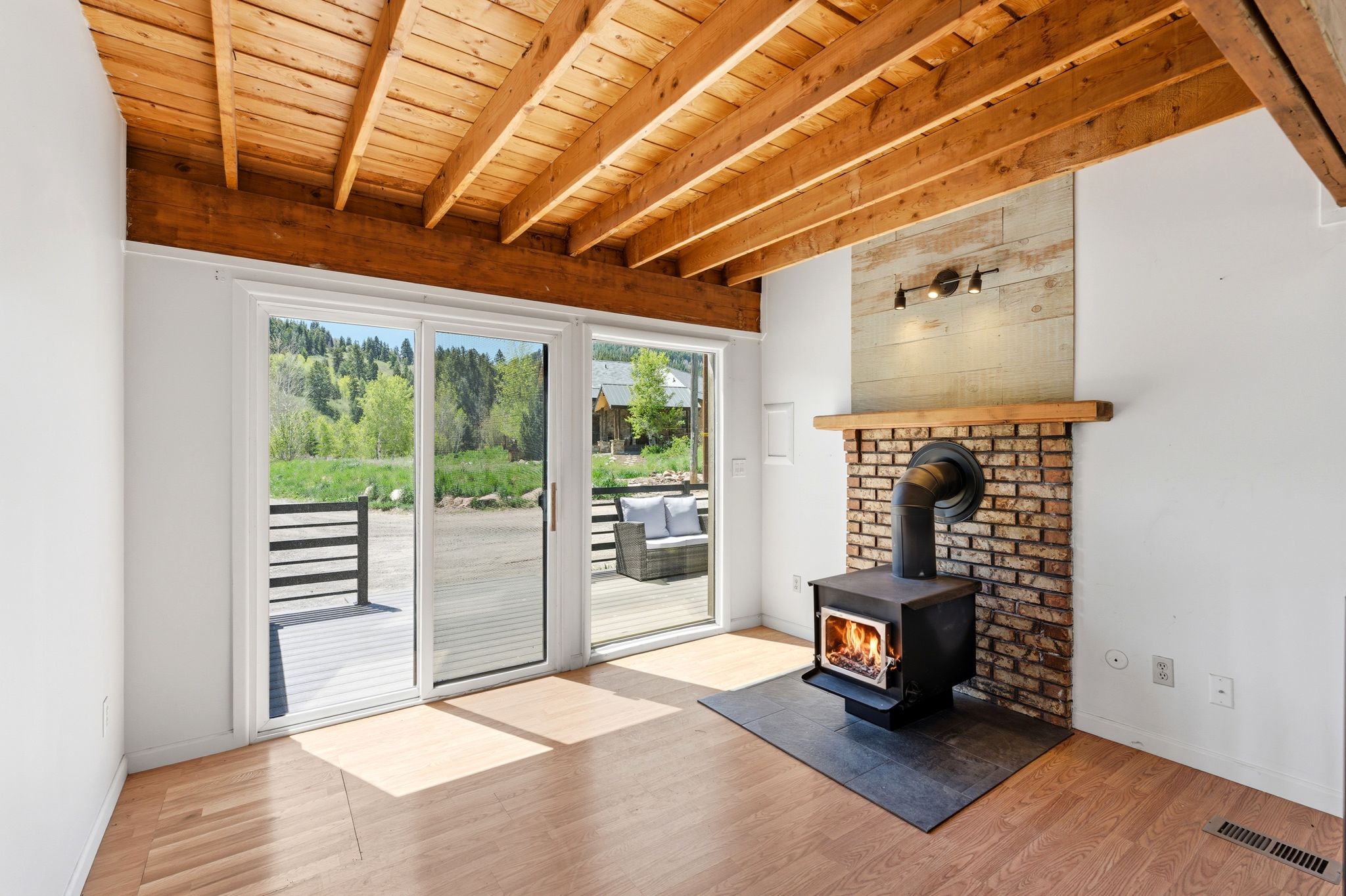 Exposed wood beam ceiling with wood-finish flooring