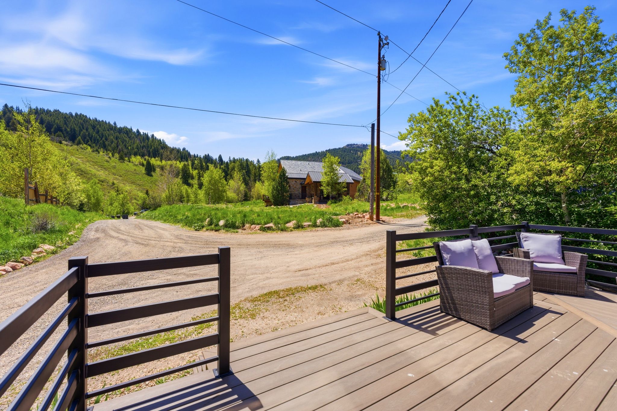 Spacious outdoor deck with composite decking and dark railings