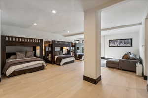 Bedroom with light wood-style floors and recessed lighting