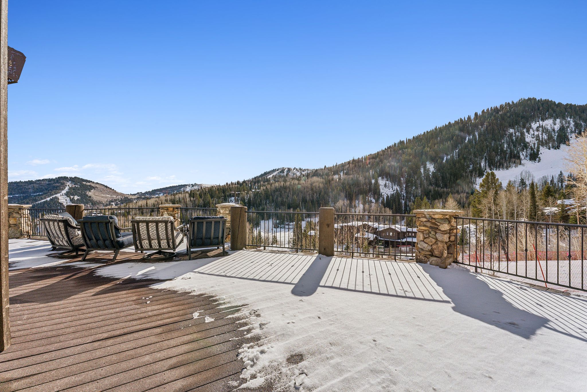 Wooden terrace featuring a mountain view