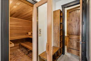 Relaxing sauna / steam room featuring wooden ceiling