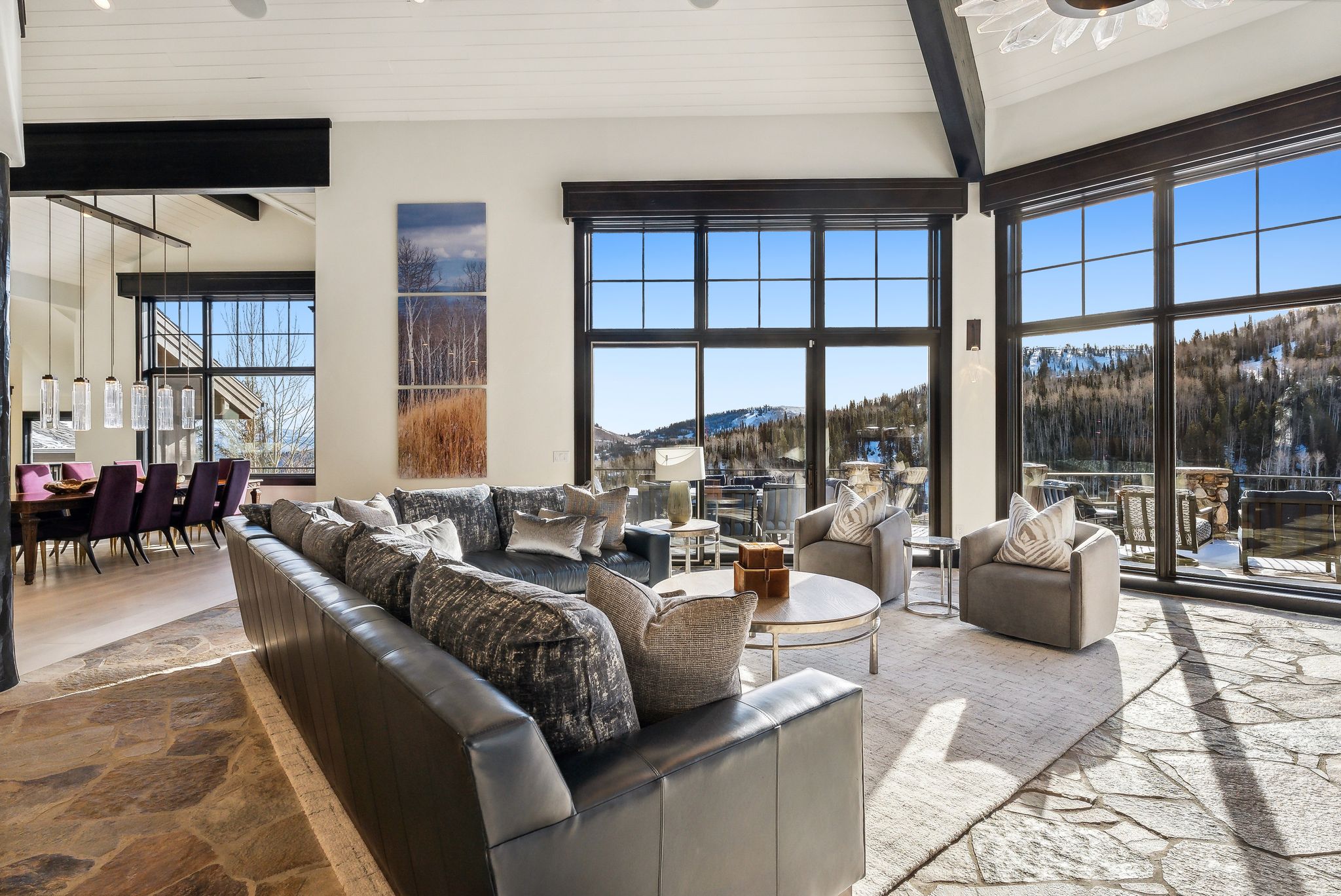 Living area featuring stone flooring and a mountain view