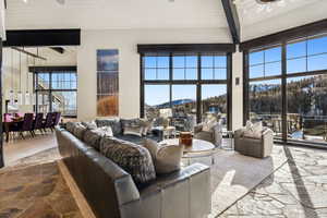 Living area featuring stone flooring and a mountain view