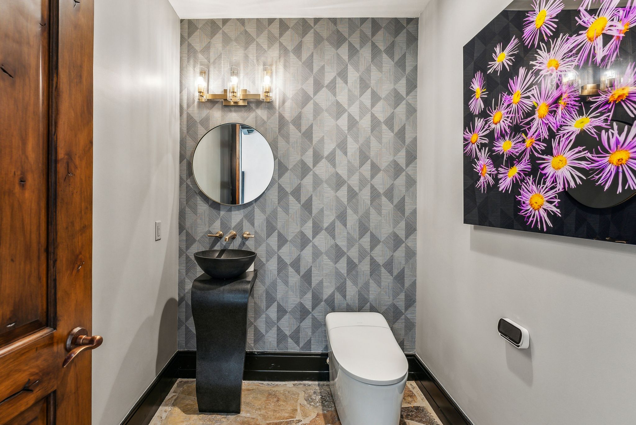 Bathroom with baseboards and tile walls