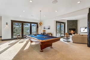Playroom featuring billiards, light colored carpet, a fireplace, and recessed lighting