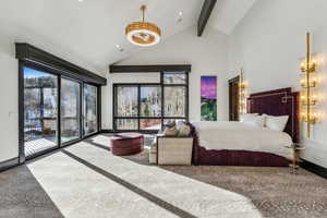 Bedroom with lofted ceiling, access to exterior, and recessed lighting