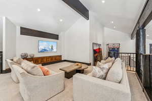 Living room with light carpet and recessed lighting