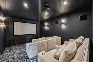Cinema room featuring recessed lighting