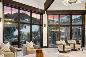 Sunroom with suspended lighting