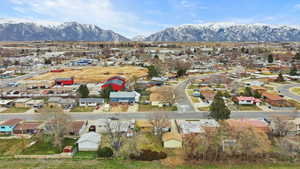 Aerial view of residential area featuring a mountain backdrop