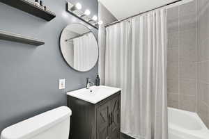 Full bath with vanity and shower / bathtub combination with curtain