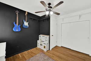 Unfurnished bedroom with light wood-style flooring and ceiling fan