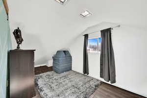 Additional living space with dark wood finished floors