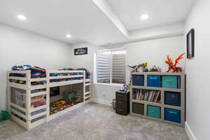 Bedroom featuring light carpet and recessed lighting