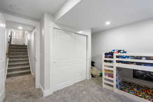 Bedroom featuring carpet, a closet, and recessed lighting
