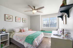 Bedroom featuring carpet flooring and ceiling fan, and  reading nook