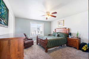 Bedroom with carpet flooring and ceiling fan