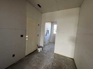 Unfurnished room featuring concrete floors