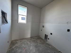 Laundry area featuring hookup for a washing machine, hookup for an electric dryer, and electric panel