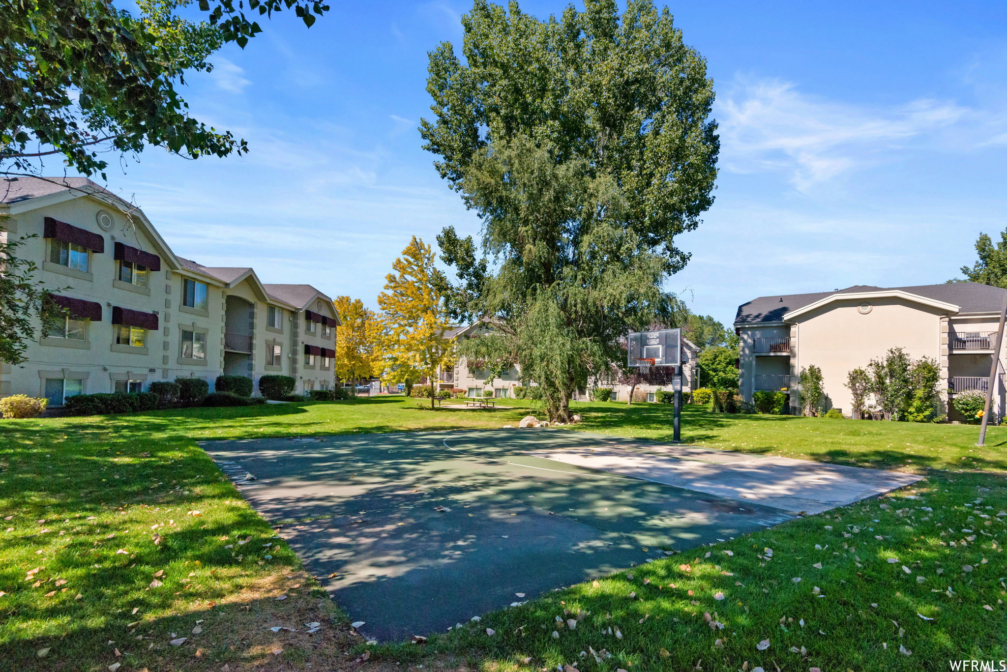 View of home's community featuring community basketball court