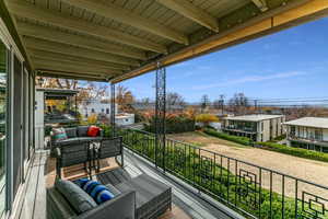 Balcony featuring an outdoor hangout area and a residential view