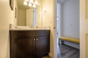 Bathroom with vanity and wood finished floors