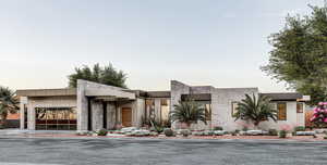 Contemporary house featuring stone siding