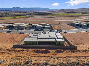 Aerial perspective of suburban area with a mountainous background and a desert landscape