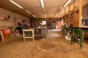 Miscellaneous room featuring a workshop area