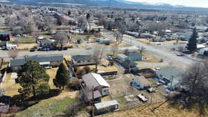 Aerial perspective of suburban area featuring a mountainous background