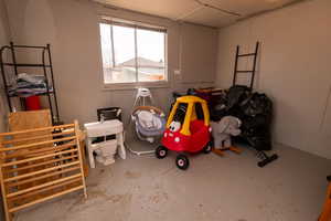 Misc room featuring unfinished concrete floors