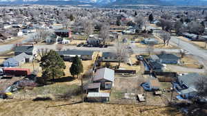 Aerial view of residential area featuring a mountainous background